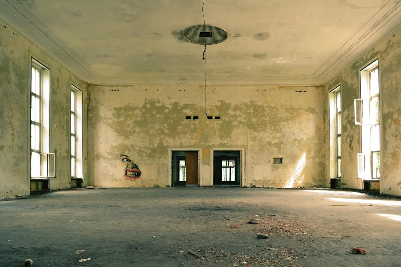 A bare room with hard walls and a hard floor